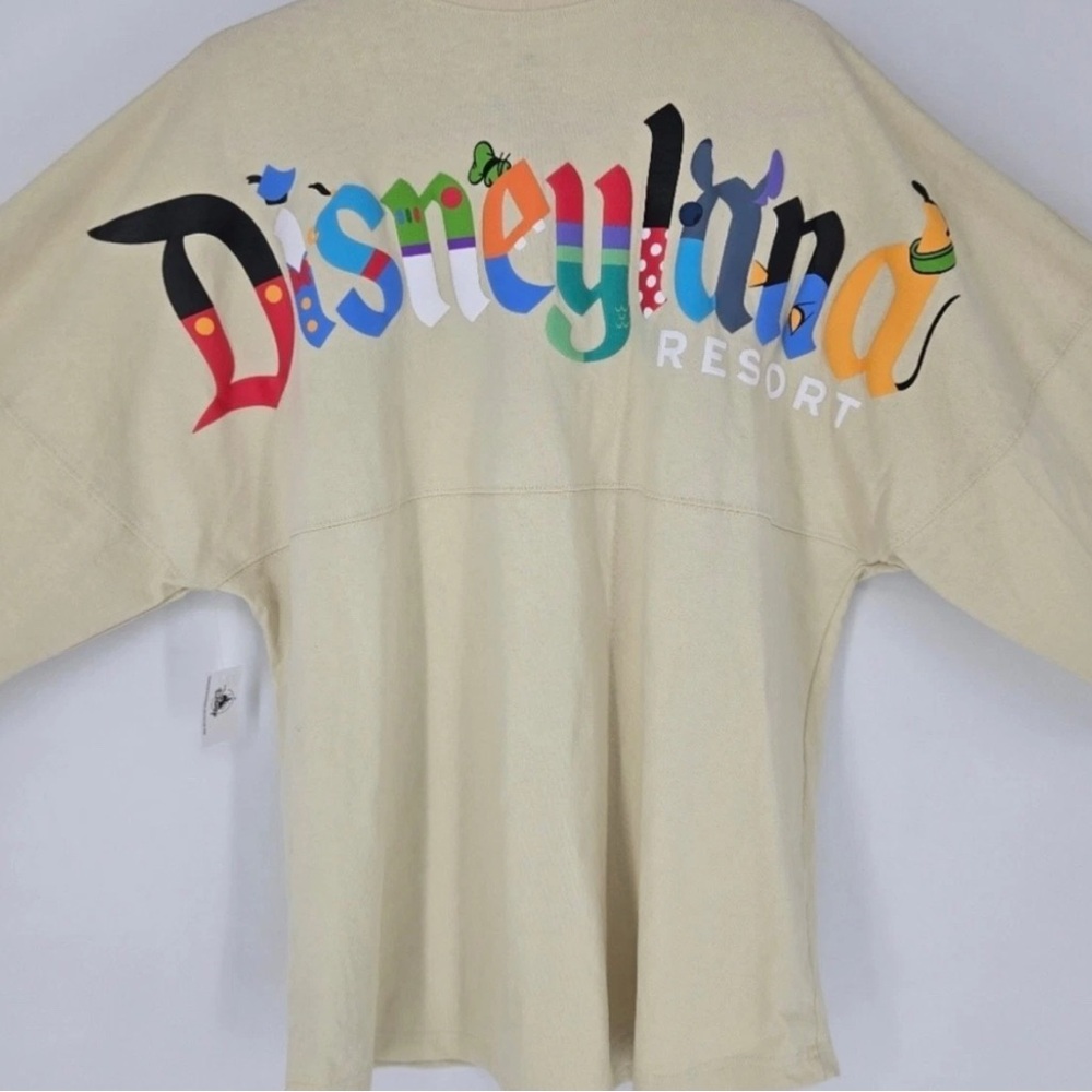 Disney Parks Disneyland Beige Spirit Jersey – Character Letters - Size Large NWT
